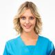 A female doctor A female doctor with a folder, standing isolated on white background